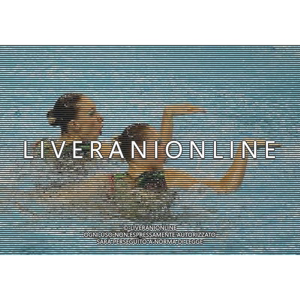 SHANGHAI, July 18, 2011 Natalia Ishchenko/Svetlana Romashina of Russia compete in the final of the technical duets of synchronized swimming event at the 14th FINA World Championships in Shanghai, east China, July 18, 2011. The Russian duet claimed the title with 98.200 points. (/Ren Long) (zgp)