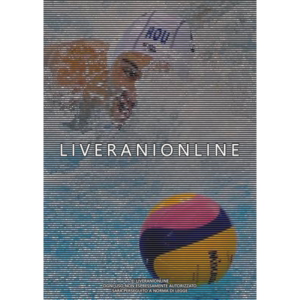 SHANGHAI, July 18, 2011 A player of Romania vies for the ball in the preliminary round of the men\'s water polo event between Romania and Australia at the 14th FINA World Championships in Shanghai, east China, July 18, 2011. Australia beat Romania with 9 8. (/Liu Ying) (sqq)