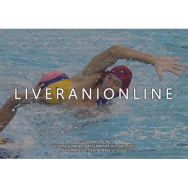 SHANGHAI, July 18, 2011 Goalkeeper of Kazakhstan (R) defends a shot in the preliminary round of the men\'s water polo event between Kazakhstan and Spain at the 14th FINA World Championships in Shanghai, east China, July 18, 2011. Spain beat Kazakhstan with 18 5. (/Liu Ying) (sqq)