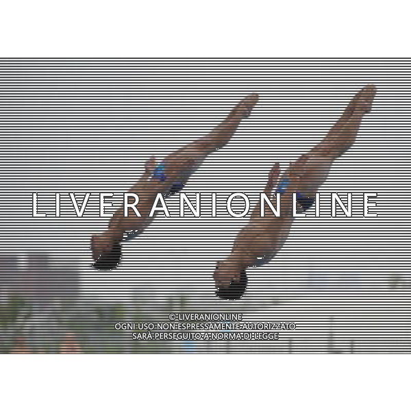 (110719) -- SHANGHAI, July 19, 2011 () -- China\'s Qin Kai/Luo Yutong (L) compete during the preliminary round of the men\'s 3m synchronized springboard diving event at the 14th FINA World Championships in Shanghai, east China, July 19, 2011. Qin Kai/Luo Yutong ranked first with 452.19 points. (/Yang Lei) (zgp)