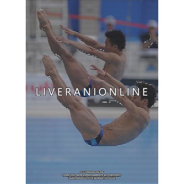 (110719) -- SHANGHAI, July 19, 2011 () -- China\'s Qin Kai/Luo Yutong (back) compete during the preliminary round of the men\'s 3m synchronized springboard diving event at the 14th FINA World Championships in Shanghai, east China, July 19, 2011. Qin Kai/Luo Yutong ranked first with 452.19 points. (/Yang Lei) (zgp)