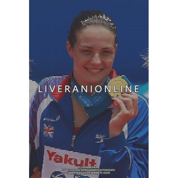 (110719) -- SHANGHAI, July 19, 2011 () -- Britain\'s Keri-Anne Michelle Payne poses in the awarding ceremony of the women\'s open water 10km race at the 14th FINA World Championships in Shanghai, east China, July 19, 2011. Keri-Anne Michelle Payne grabbed the gold medal with 2:01:58.1.(/Pei Xin) (sqq)