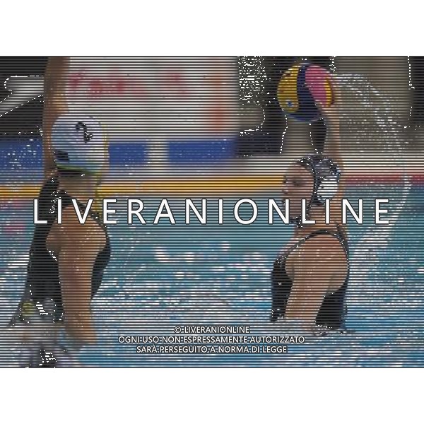SHANGHAI, July 19, 2011 Kelly Flona Mason (R) of New Zealand competes in the preliminary round of women\'s water polo event between Australia and New Zealand at the 14th FINA World Championships in Shanghai, east China, July 19, 2011. Australia won the match 12 4. (/Yang Zongyou) (sqq)