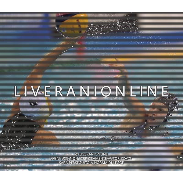 SHANGHAI, July 19, 2011 Ashely Elizabeth Smallfield (R) of New Zealand competes in the preliminary round of women\'s water polo event between Australia and New Zealand at the 14th FINA World Championships in Shanghai, east China, July 19, 2011. Australia won the match 12 4. (/Yang Zongyou) (sqq)