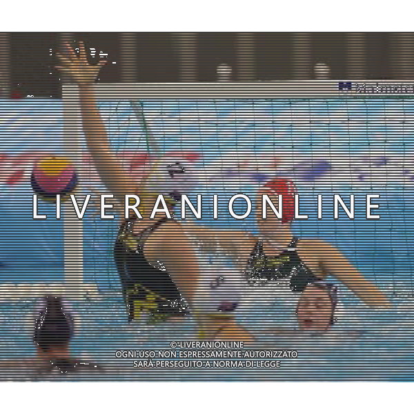 SHANGHAI, July 19, 2011 Victoria Jayne Brown (back) of Australia defends a shoot in the preliminary round of women\'s water polo event between Australia and New Zealand at the 14th FINA World Championships in Shanghai, east China, July 19, 2011. Australia won the match 12 4. (/Yang Zongyou) (sqq)