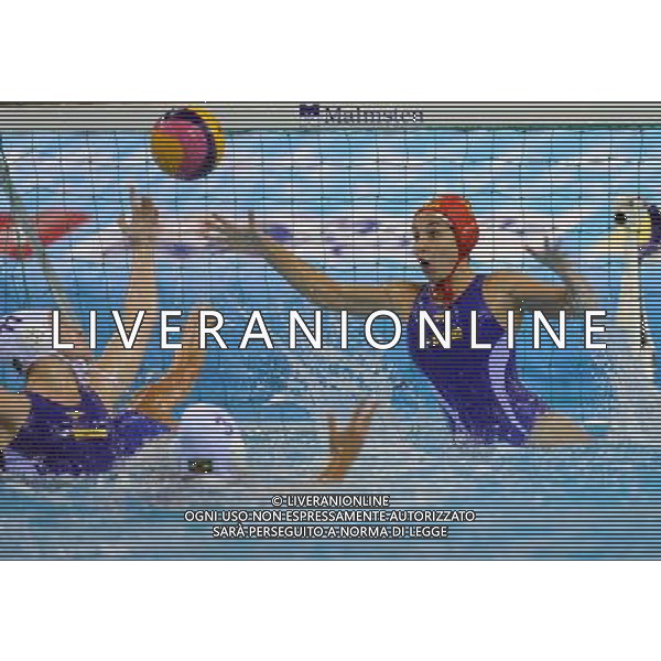 SHANGHAI, July 19, 2011 Tess Oliveira (R) of Brazil defends during the preliminary of the women\'s waterpolo between Greece and Brazil at the 14th FINA World Championships in Shanghai, east China, July 19, 2011. Brazil lost 8 11. (/Yang Zongyou) (lm)