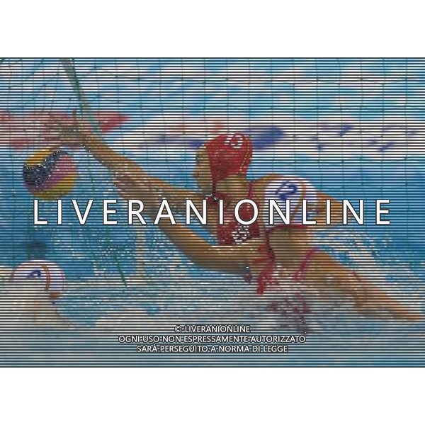 SHANGHAI, July 19, 2011 Laura Ester Ramos (back) of Spain defends a shot in the preliminary round of women\'s water polo event between Spain and Russia at the 14th FINA World Championships in Shanghai, east China, July 19, 2011. Russia won the match 18 8. (/Yang Zongyou) (sqq)