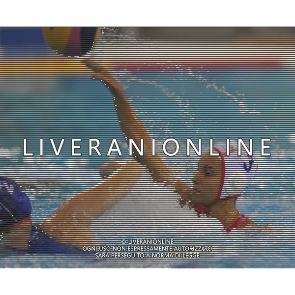 SHANGHAI, July 19, 2011 Anna Espar Illaquet (R) of Spain competes in the preliminary round of women\'s water polo event between Spain and Russia at the 14th FINA World Championships in Shanghai, east China, July 19, 2011. Russia won the match 18 8. (/Yang Zongyou) (sqq)