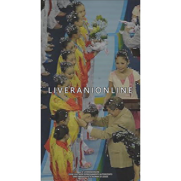 SHANGHAI, July 19, 2011 Chinese swimmers attend the awarding ceremony of the technical teams of the synchronized swimming event at the 14th FINA World Championships in Shanghai, east China, July 19, 2011. The Chinese team won the silver medal with 96.800 points. (/Wang Yuguo) (zgp)