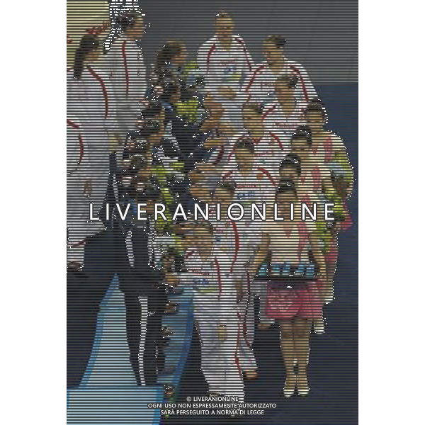 SHANGHAI, July 19, 2011 Russian swimmers (white) and Spanish swimmers are seen at the awarding ceremony of the technical teams of the synchronized swimming event at the 14th FINA World Championships in Shanghai, east China, July 19, 2011. The Russian team claimed the title with 98.300 points. The Spanish team won the bronze medal with 96.000 points. (/Wang Yuguo) (zgp)