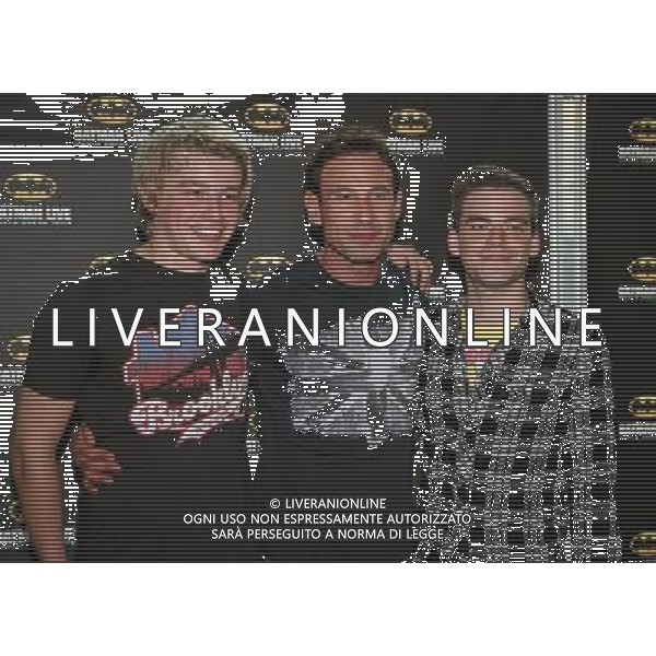 PJ Brennan, Paul Opacic and Miles Higson on the red carpet at the world premiere of Batman Live at the Manchester Evening News Arena, Manchester, England, 19th July 2011. Photograph by Mike Gray/LFI