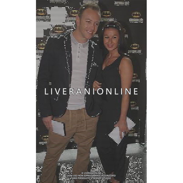 Hayley Tamaddon and Dan Whiston on the red carpet at the world premiere of Batman Live at the Manchester Evening News Arena, Manchester, England, 19th July 2011. Photograph by Mike Gray/LFI