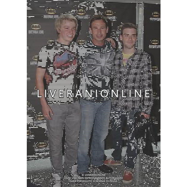 PJ Brennan, Paul Opacic and Miles Higson on the red carpet at the world premiere of Batman Live at the Manchester Evening News Arena, Manchester, England, 19th July 2011. Photograph by Mike Gray/LFI