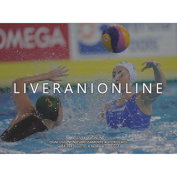 SHANGHAI, July 19, 2011 Kimberly Kay of South Africa (L) defends in the preliminary round of women\'s water polo event between Italy and South Africa at the 14th FINA World Championships in Shanghai, east China, July 19, 2011. Italy won the match 18 2. (/Yang Zongyou) (sqq)