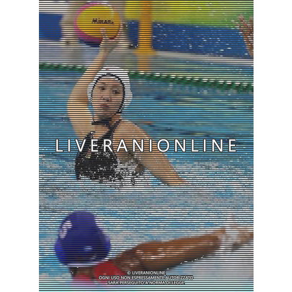 SHANGHAI, July 19, 2011 Sun Yujun (back) of China shoots in the preliminary round of women\'s water polo event between China and Cuba at the 14th FINA World Championships in Shanghai, east China, July 19, 2011. China won the match 19 6. (/Chen Fei) (sqq)
