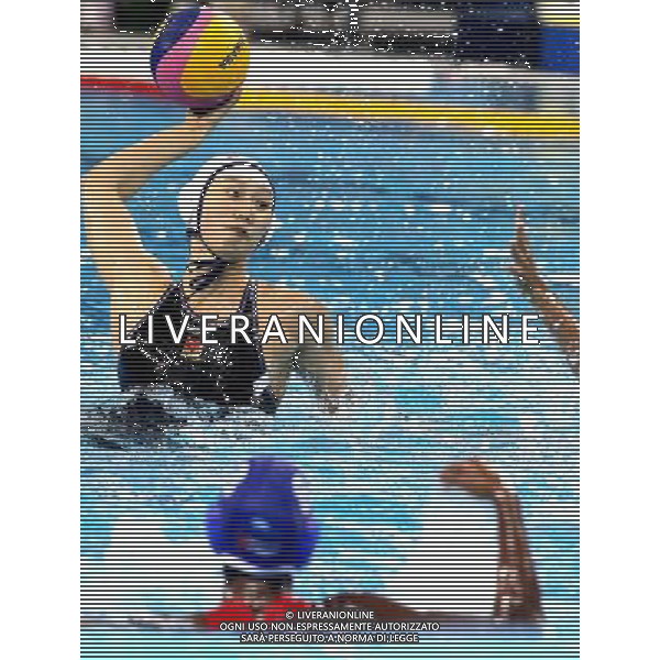 SHANGHAI, July 19, 2011 Chen Yuan (back) of China shoots in the preliminary round of women\'s water polo event between China and Cuba at the 14th FINA World Championships in Shanghai, east China, July 19, 2011. China won the match 19 6. (/Chen Fei) (sqq)