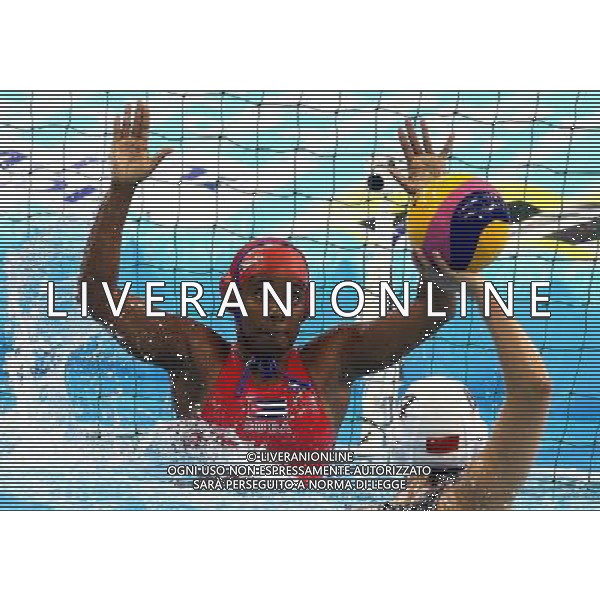 SHANGHAI, July 19, 2011 Sun Yujun (front) of China shoots in the preliminary round of women\'s water polo event between China and Cuba at the 14th FINA World Championships in Shanghai, east China, July 19, 2011. China won the match 19 6. (/Chen Fei) (sqq)