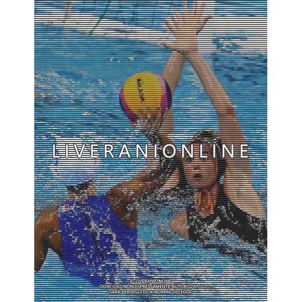 SHANGHAI, July 19, 2011 Marta Colaiocco of Italy (L) competes in the preliminary round of women\'s water polo event between Italy and South Africa at the 14th FINA World Championships in Shanghai, east China, July 19, 2011. Italy won the match 18 2. (/Chen Fei) (sqq)