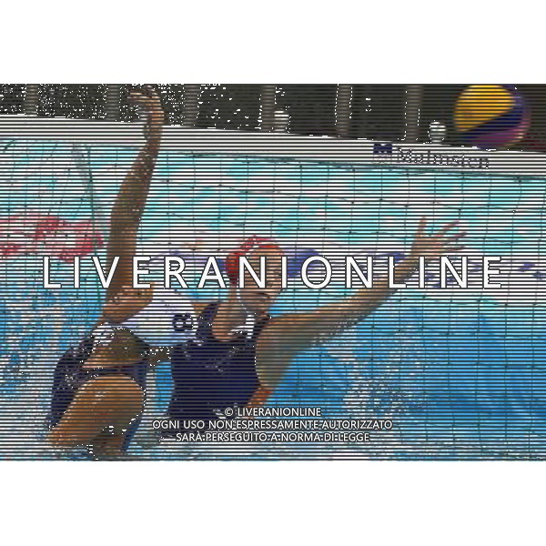 SHANGHAI, July 19, 2011 The goalkeeper (back) of Kazakhstan defends a shot in the preliminary round of women\'s water polo event between the Netherlands and Kazakhstan at the 14th FINA World Championships in Shanghai, east China, July 19, 2011. The Netherlands won the match 13 3. (/Chen Fei) (sqq)