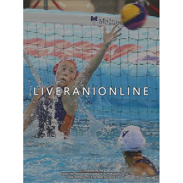 SHANGHAI, July 19, 2011 The goalkeeper (back) of Kazakhstan defends a shot in the preliminary round of women\'s water polo event between the Netherlands and Kazakhstan at the 14th FINA World Championships in Shanghai, east China, July 19, 2011. The Netherlands won the match 13 3. (/Chen Fei) (sqq)