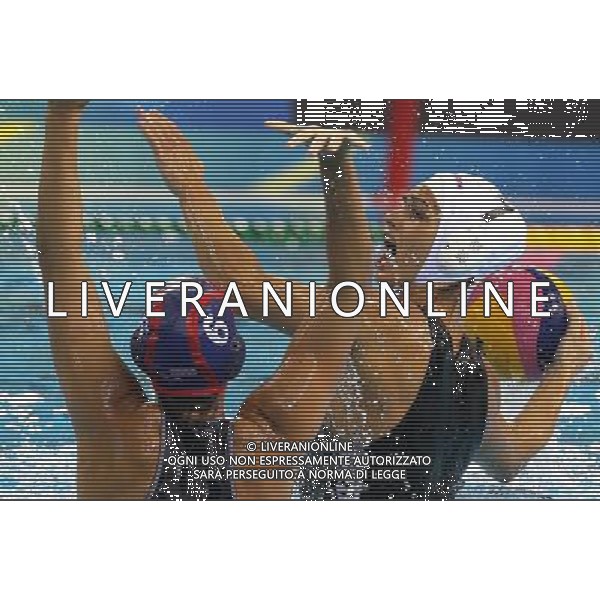 SHANGHAI, July 19, 2011 Margaret Ann Steffens (front) of the United States and Rita Dravucz of Hungary vie for the ball in the preliminary round of women\'s water polo event between the United States and Hungary at the 14th FINA World Championships in Shanghai, east China, July 19, 2011. The United States won the match 16 7. (/Chen Fei) (sqq)
