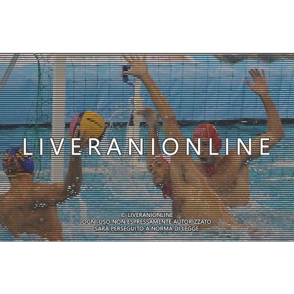 (110720) SHANGHAI, July 20, 2011 () Inaki Aguilar Morillo (back) of Spain defends a shot in the preliminary round of men\'s water polo event between Spain and Montenegro at the 14th FINA World Championships in Shanghai, east China, July 20, 2011. Montenegro won the match 9 7. (/Yang Lei) (sqq)