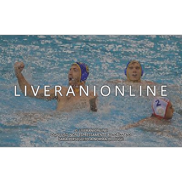 (110720) SHANGHAI, July 20, 2011 () Milan Ticic (L) of Montenegro celebrates a point in the preliminary round of men\'s water polo event between Spain and Montenegro at the 14th FINA World Championships in Shanghai, east China, July 20, 2011. Montenegro won the match 9 7. (/Yang Lei) (sqq)