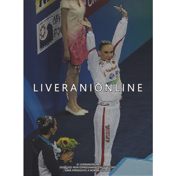 (110720) SHANGHAI, July 20, 2011 () Natalia Ishchenko of Russia waves to spectators at the awarding ceremony of the solo free synchronized swimming competition at the 14th FINA World Championships in Shanghai, east China, July 20, 2011. Natalia Ishchenko claimed the title with 98.550 points. (/Guo Yong)