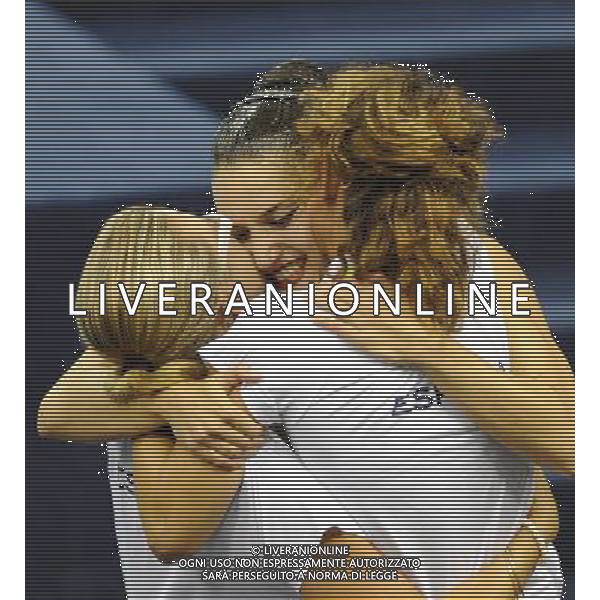 (110720) SHANGHAI, July 20, 2011 () Andrea Fuentes (C) of Spain hugs her coaches after the final of the solo free synchronized swimming competition at the 14th FINA World Championships in Shanghai, east China, July 20, 2011. Andrea Fuentes won the silver medal with 96.520 points. (/Yang Zongyou) (zgp)