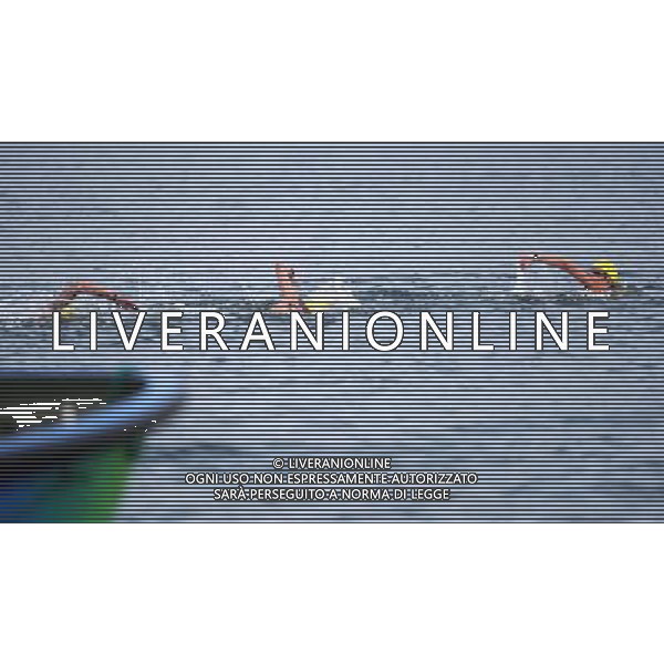 (110721) -- SHANGHAI, July 21, 2011 () -- Andrew Gemmell, Ashley Grace Twichell, and Sean Ryan of the United States compete in the open water 5km team event at the 14th FINA World Championships in Shanghai, east China, July 21, 2011. The U.S. team claimed the title with 57:00.6. (/Guo Yong) (zgp)