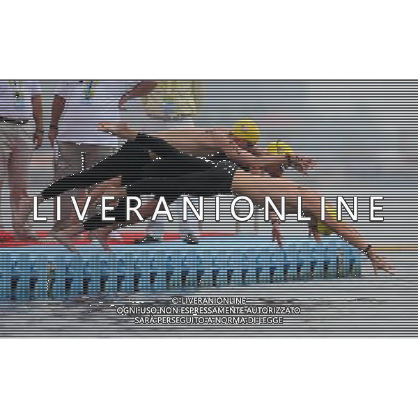 (110721) -- SHANGHAI, July 21, 2011 () -- Andrew Gemmell, Ashley Grace Twichell, and Sean Ryan of the United States start in the open water 5km team event at the 14th FINA World Championships in Shanghai, east China, July 21, 2011. The U.S. team claimed the title with 57:00.6. (/Guo Yong) (zgp)