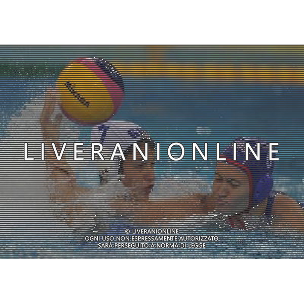 (110721) -- SHANGHAI, July 21, 2011 () -- Natalia Ryzhova-Alenicheva (R) of Russia defends a shot in the preliminary round of women\'s water polo event between Greece and Russia at the 14th FINA World Championships in Shanghai, east China, July 21, 2011. Greece won the match 6-5. (/Wang Yuguo) (sqq)