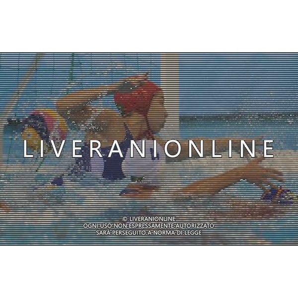 (110721) -- SHANGHAI, July 21, 2011 () -- Tess Oliveira (back) of Brazil fails to defend a shot in the preliminary round of women\'s water polo event between Spain and Brazil at the 14th FINA World Championships in Shanghai, east China, July 21, 2011. Spain won the match 12-4. (/Wang Yuguo) (sqq)