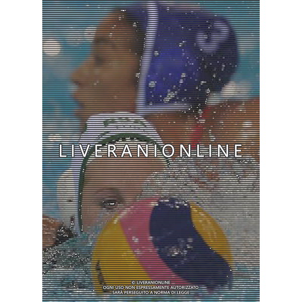(110721) -- SHANGHAI, July 21, 2011 () -- Kimberly Kay (front) of South Africa competes in the preliminary round of women\'s water polo event between South Africa and Cuba at the 14th FINA World Championships in Shanghai, east China, July 21, 2011. South Africa drew 9-9 with Cuba. (/Wang Yuguo) (sqq)