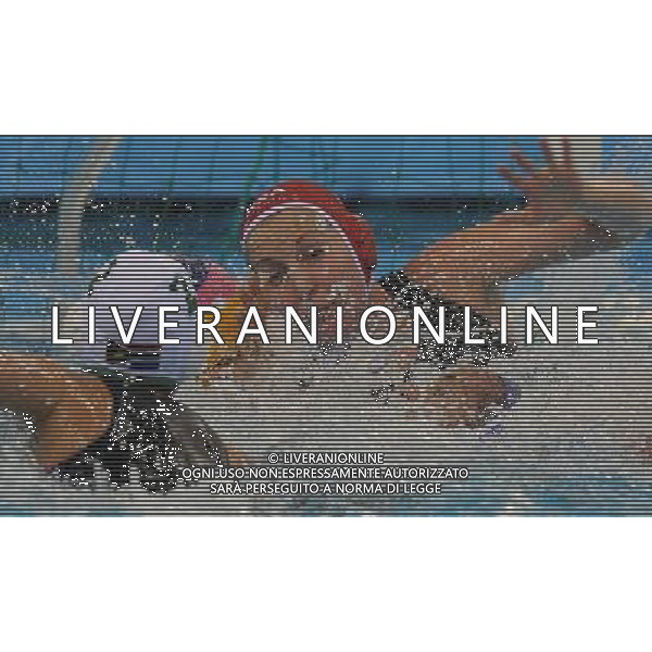 (110721) -- SHANGHAI, July 21, 2011 () -- Leigh Maarschalk (back) of South Africa competes in the preliminary round of women\'s water polo event between South Africa and Cuba at the 14th FINA World Championships in Shanghai, east China, July 21, 2011. South Africa drew 9-9 with Cuba. (/Wang Yuguo) (sqq)
