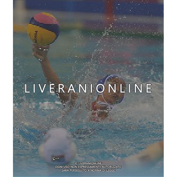 (110721) -- SHANGHAI, July 21, 2011 () -- Yanet Lopez Hernandez (back) of Cuba shoots in the preliminary round of women\'s water polo event between South Africa and Cuba at the 14th FINA World Championships in Shanghai, east China, July 21, 2011. South Africa drew 9-9 with Cuba. (/Wang Yuguo) (sqq)