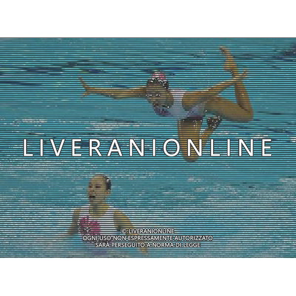 (110721) -- SHANGHAI, July 21, 2011 () -- Swimmers of China compete in the synchronized swimming free combination final at the 14th FINA World Championships in Shanghai, east China, July 21, 2011. The Chinese team won the silver medal with 96.390 points. (/Yang Lei)
