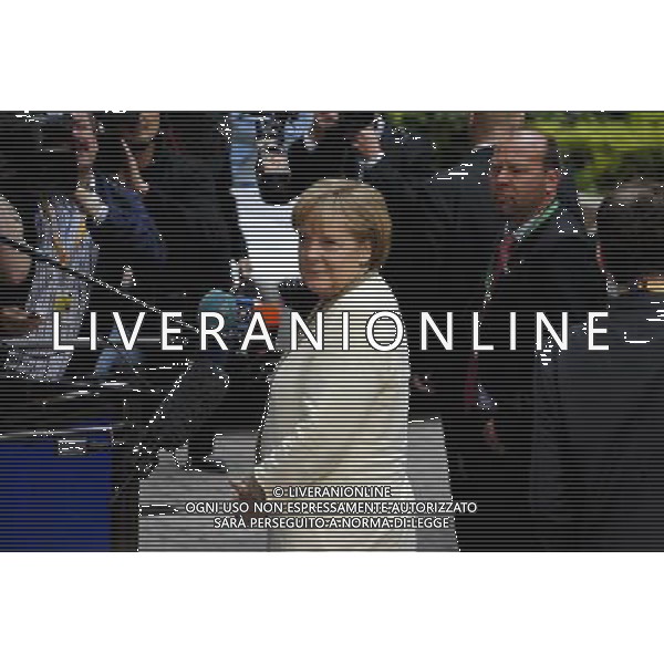 Germany\'s Chancellor Angela Merkel arrives fot the EU summit at the European Council headquarters in Brussels, Belgium on 2011-07-21 Eurogroup chairman Jean-Claude Juncker said that eurozone leaders would not rule out a Greek debt default but that everything should be done to prevent it. by Wiktor Dabkowski