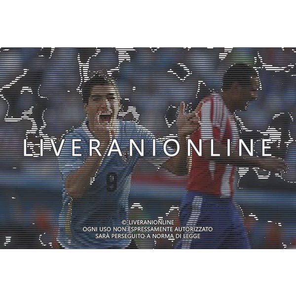 (110724) -- BUENOS AIRES, July 24, 2011 () -- Uruguay\'s Luis Suarez (L) celebrates his goal during the final match of Copa America between Uruguay and Paraguay in Buenos Aires, Argentina, on July 24, 2011. (/Martin Zabala)