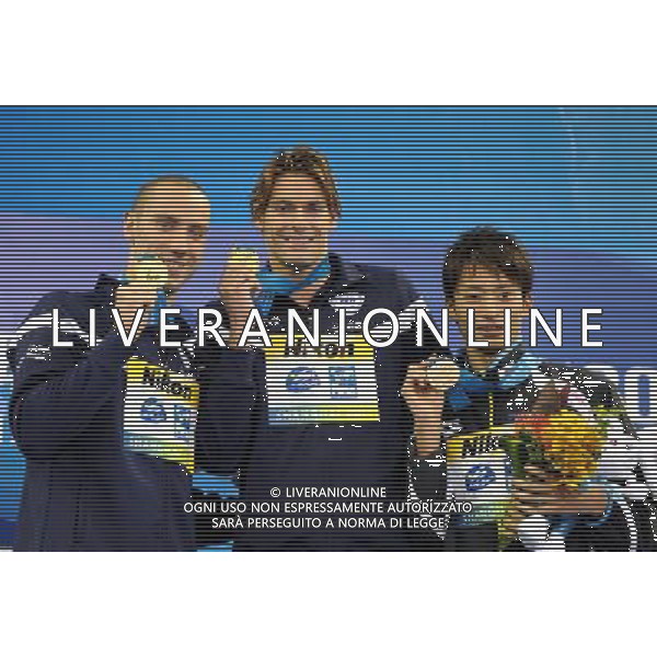 (110726) -- SHANGHAI, July 26, 2011 () -- Camille Lacourt (C) and Jeremy Stravius (L) of France, Ryosuke Irie of Japan pose in the awarding ceremony of men\'s 100m backstroke swimming event at the 14th FINA World Championships in Shanghai, east China, July 26, 2011. Camille Lacourt and Jeremy Stravius of France shared the gold medal with 52.76. Ryosuke Irie got the bronze medal with 52.98. (/Yang Lei) (sqq)