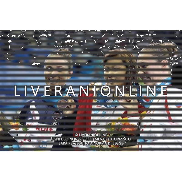 (110726) -- SHANGHAI, July 26, 2011 () -- Zhao Jing (C) of China, Anastasia Zueva (R) of Russia, Natalie Coughlin of the United States pose in the awarding ceremony of women\'s 100m backstroke swimming event at the 14th FINA World Championships in Shanghai, east China, July 26, 2011. Zhao Jing claimed the title with 59.05. Anastasia Zueva won the silver medal with 59.06. Natalie Coughlin got the bronze medal with 59.15. (/Liu Ying) (sqq)