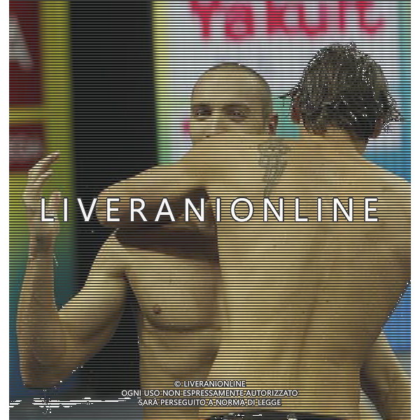 (110726) -- SHANGHAI, July 26, 2011 () -- Camille Lacourt and Jeremy Stravius (L) of France celebrate after the final of men\'s 100m backstroke swimming event at the 14th FINA World Championships in Shanghai, east China, July 26, 2011. Camille Lacourt and Jeremy Stravius of France shared the gold medal with 52.76. (/Fei Maohua) (zgp)