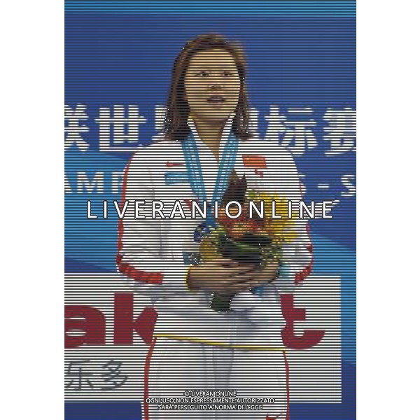 (110726) -- SHANGHAI, July 26, 2011 () -- Zhao Jing of China sings national anthem in the awarding ceremony of women\'s 100m backstroke swimming event at the 14th FINA World Championships in Shanghai, east China, July 26, 2011. Zhao Jing claimed the title with 59.05. (/Yang Lei) (sqq)