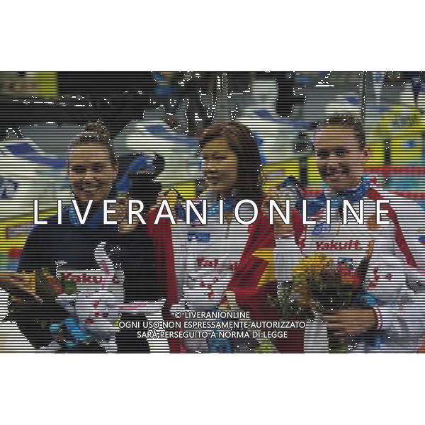 (110726) -- SHANGHAI, July 26, 2011 () -- Zhao Jing (C) of China, Anastasia Zueva (R) of Russia, Natalie Coughlin of the United States pose in the awarding ceremony of women\'s 100m backstroke swimming event at the 14th FINA World Championships in Shanghai, east China, July 26, 2011. Zhao Jing claimed the title with 59.05. Anastasia Zueva won the silver medal with 59.06. Natalie Coughlin got the bronze medal with 59.15. (/Yang Zongyou) (sqq)