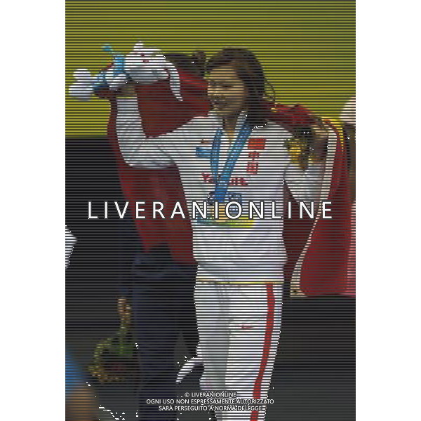 (110726) -- SHANGHAI, July 26, 2011 () -- Zhao Jing of China poses in the awarding ceremony of women\'s 100m backstroke swimming event at the 14th FINA World Championships in Shanghai, east China, July 26, 2011. Zhao Jing claimed the title with 59.05. (/Yang Zongyou) (sqq)