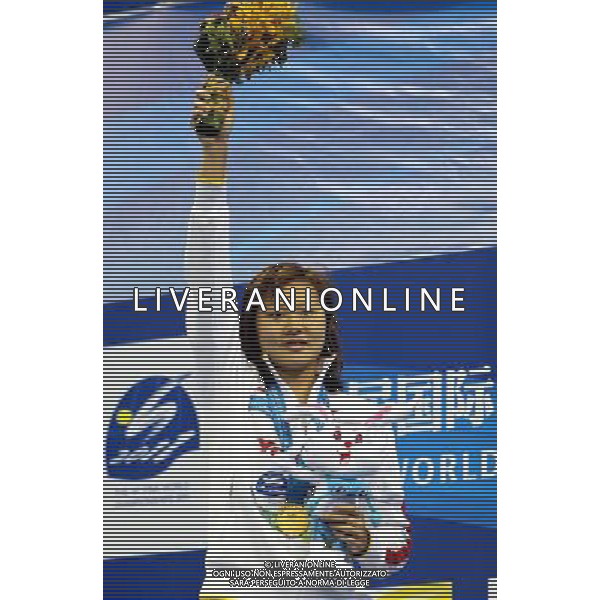 (110726) -- SHANGHAI, July 26, 2011 () -- Zhao Jing of China poses in the awarding ceremony of women\'s 100m backstroke swimming event at the 14th FINA World Championships in Shanghai, east China, July 26, 2011. Zhao Jing claimed the title with 59.05. (/Fan Jun) (sqq)