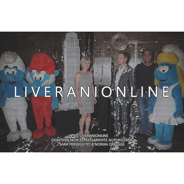 Neil Patrick Harris, Jayma Mays, Veronique Culliford, Smurfette, Papa Smurf, And Smurf Visit The Empire State Building on July 25, 2011 in New York City.