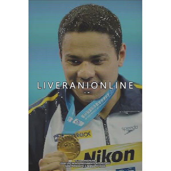 (110727) -- SHANGHAI, July 27, 2011 () -- Felipe Alves Franca Da Silva of Brazil poses in the awarding ceremony of men\'s 50m breaststroke swimming event at the 14th FINA World Championships in Shanghai, east China, July 27, 2011. Felipe Alves Franca Da Silva claimed the title with 27.01. (/Yang Zongyou) (sqq)