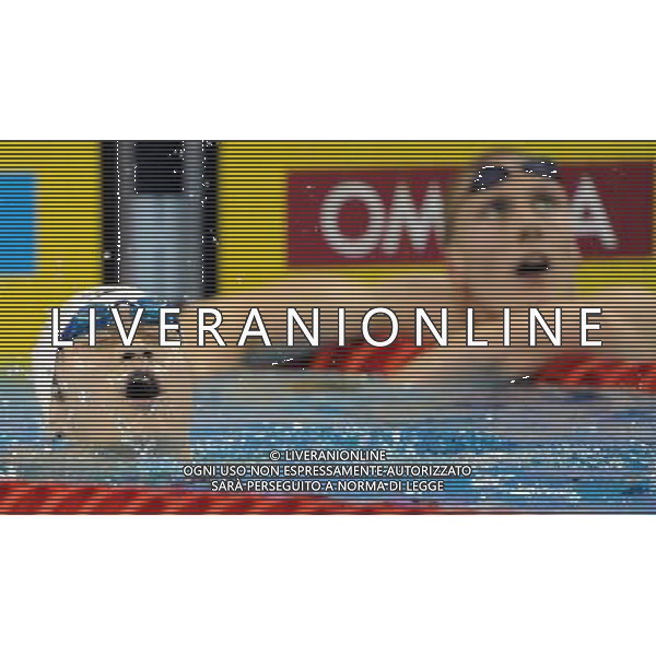 (110727) -- SHANGHAI, July 27, 2011 () -- Sun Yang (L) of China reacts after the final of men\'s 800m freestyle swimming event at the 14th FINA World Championships in Shanghai, east China, July 27, 2011. Sun Yang claimed the title with 7:38.57. (/Guo Yong) (zgp)