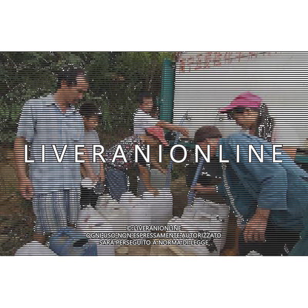 (110727) -- BAISE, July 27, 2011 () -- Villagers get water from a watercart in Zhebao Township in the Multinational Autonomous County of Longlin, south China\'s Guangxi Zhuang Autonomous Region, July 27, 2011. Due to lack of rainfalls, some areas in Guangxi suffered from heavy droughts recently, while the situation in Longlin was particularly serious. (/Lin Bin) (llp)